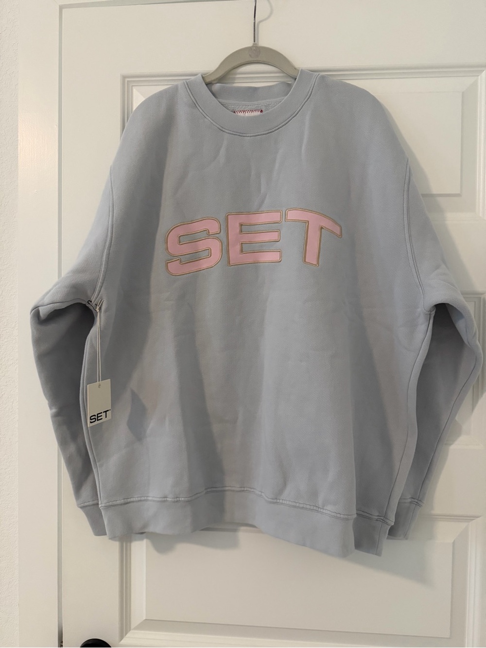 SET Active Pastel Light Blue Crewneck with Pink Logo Appliqué